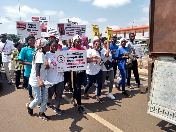 Some of the participants displaying their placards ‘Sugar-sweetened beverages increase risk of Type 2 diabetes’